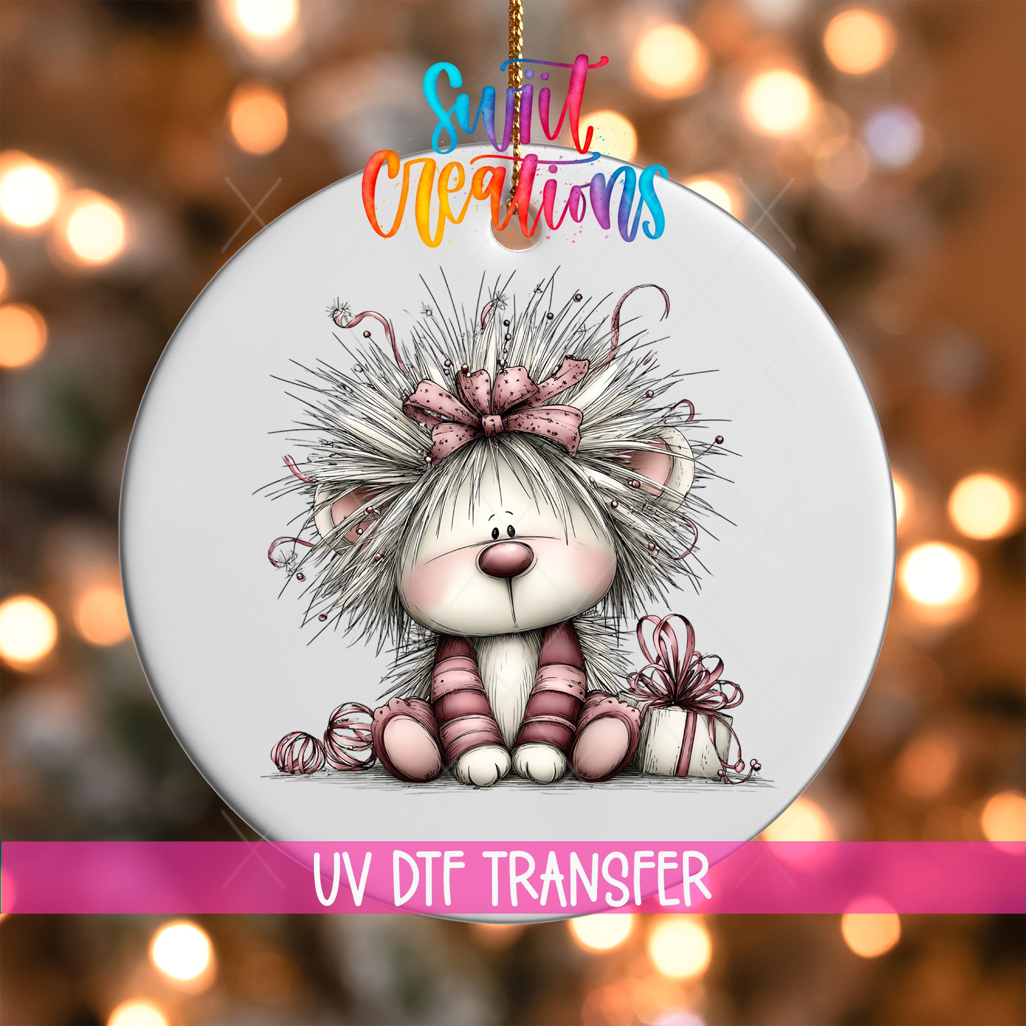 A decorative ornament featuring a whimsical illustration of a small, furry animal with a bow on its head, sitting on a gift box. The ornament is set against a background of colorful lights, creating a festive and playful atmosphere.