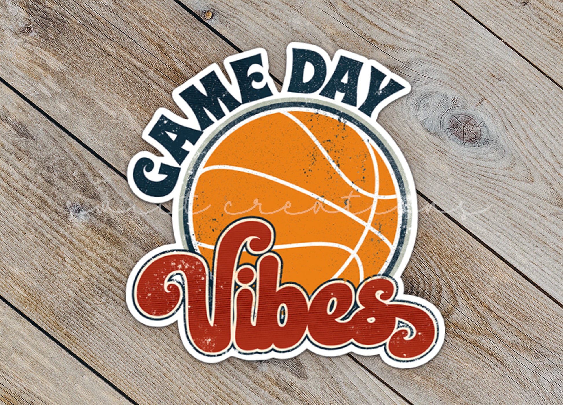 a sticker that says game day vibes on a wooden surface
