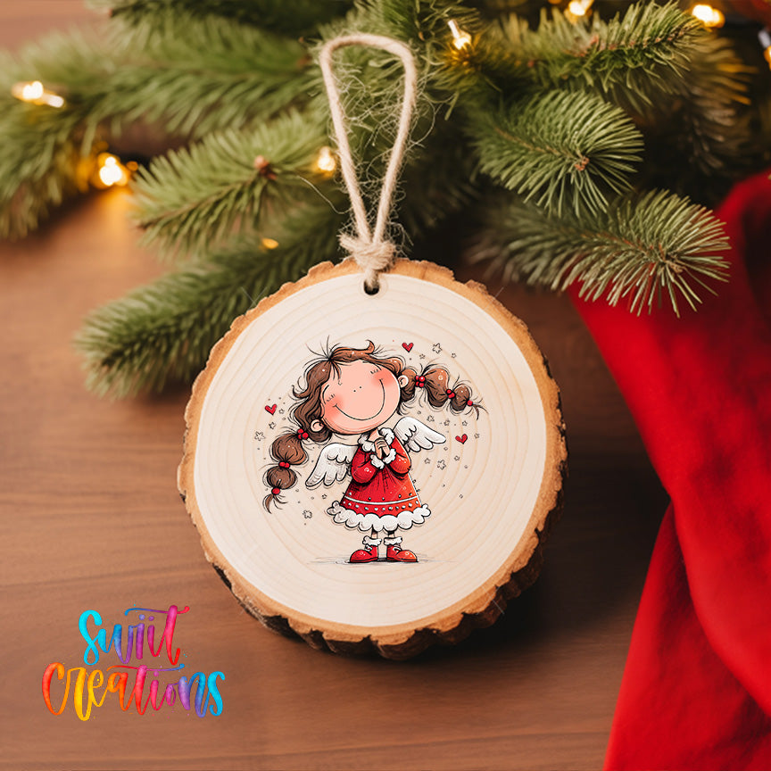 A wooden ornament featuring a smiling girl with wings, hanging on a Christmas tree.