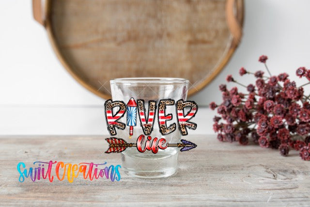 a shot glass with the words river one on it