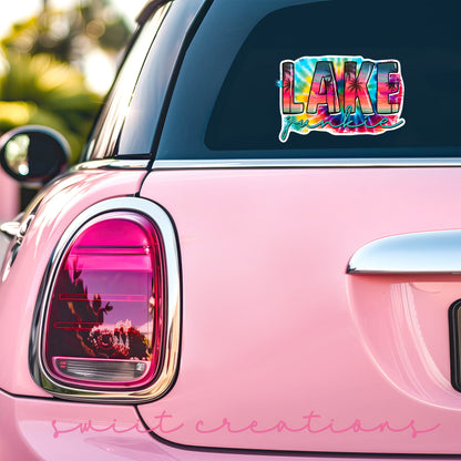 Lake Junkie sticker on the back window of a pink car