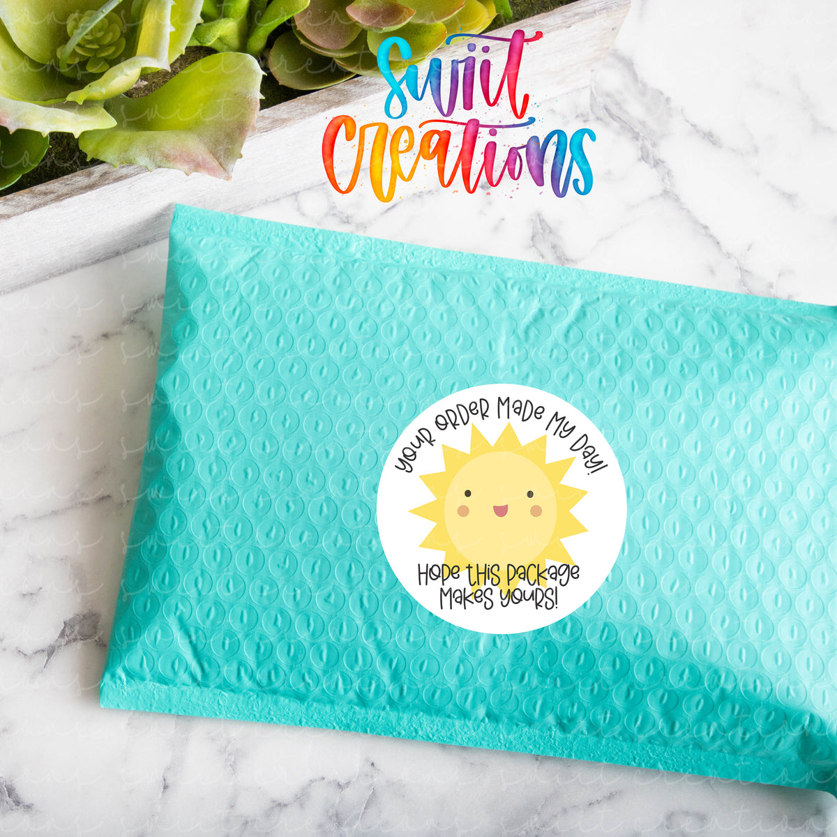 a blue envelope with a sun sticker on it