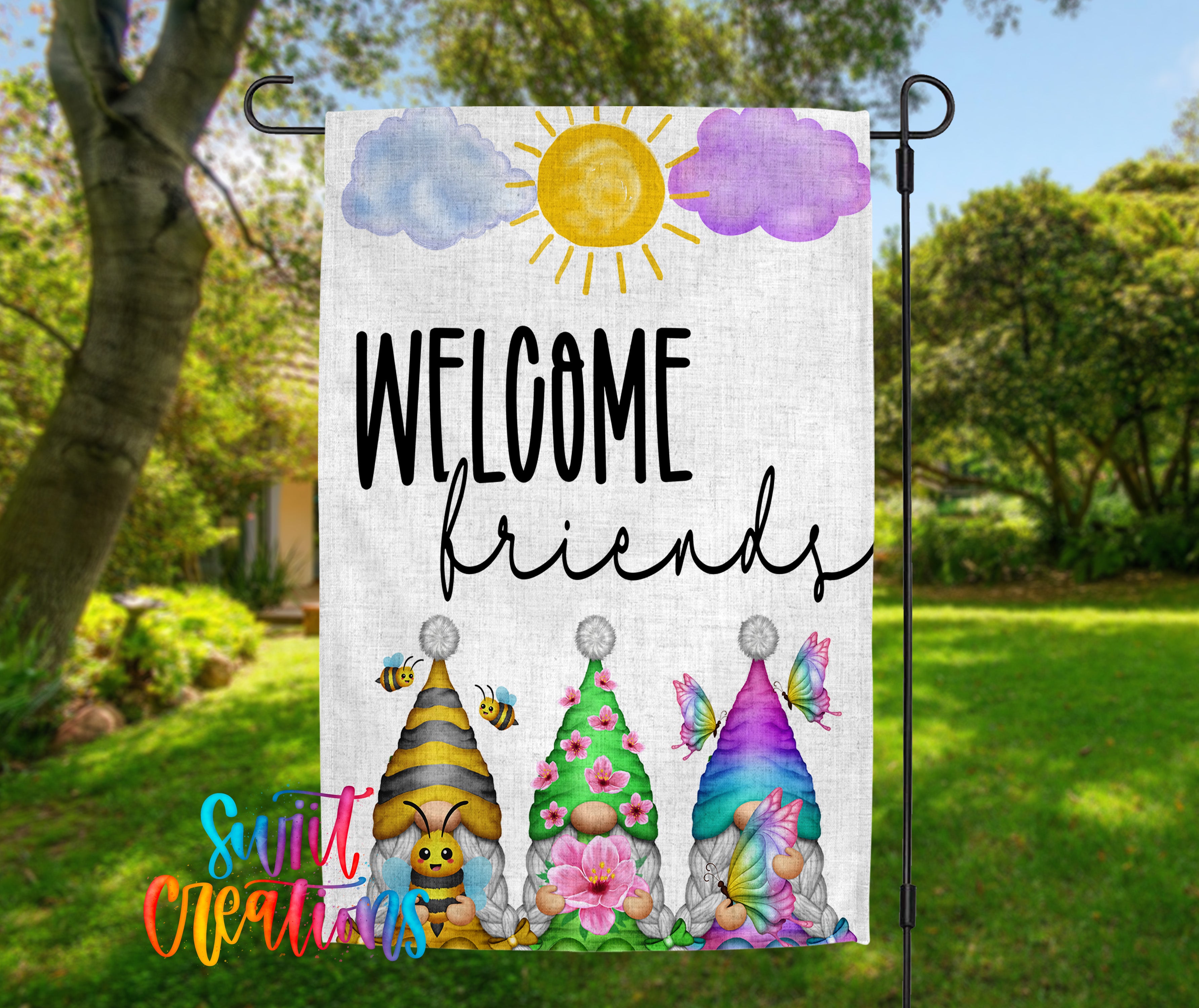 A colorful garden sign with the text "WELCOME friends" and illustrations of three gnomes wearing hats and flowers.
