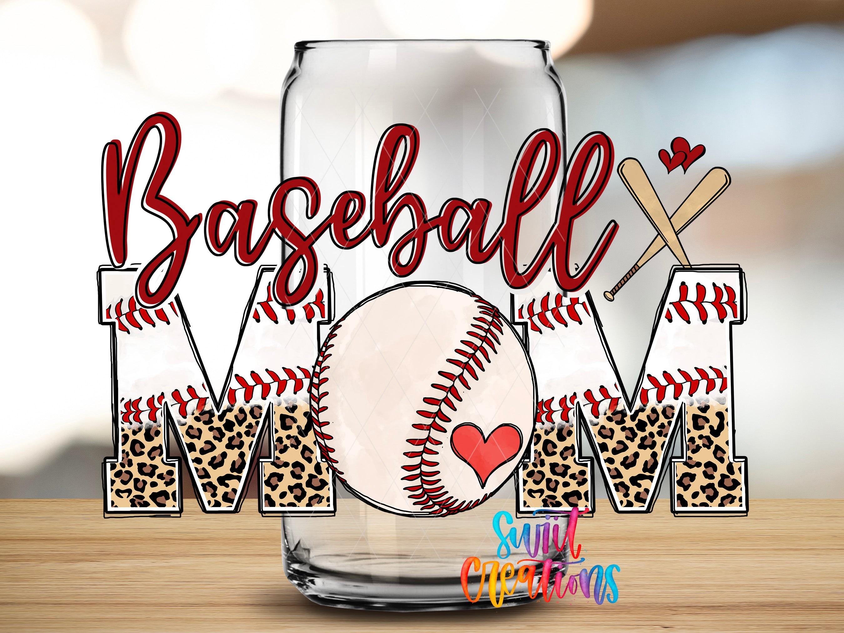 A glass can with the word "Baseball Mom" written on it, along with baseball-themed elements such as a baseball, leopard print letters, and a heart symbol.