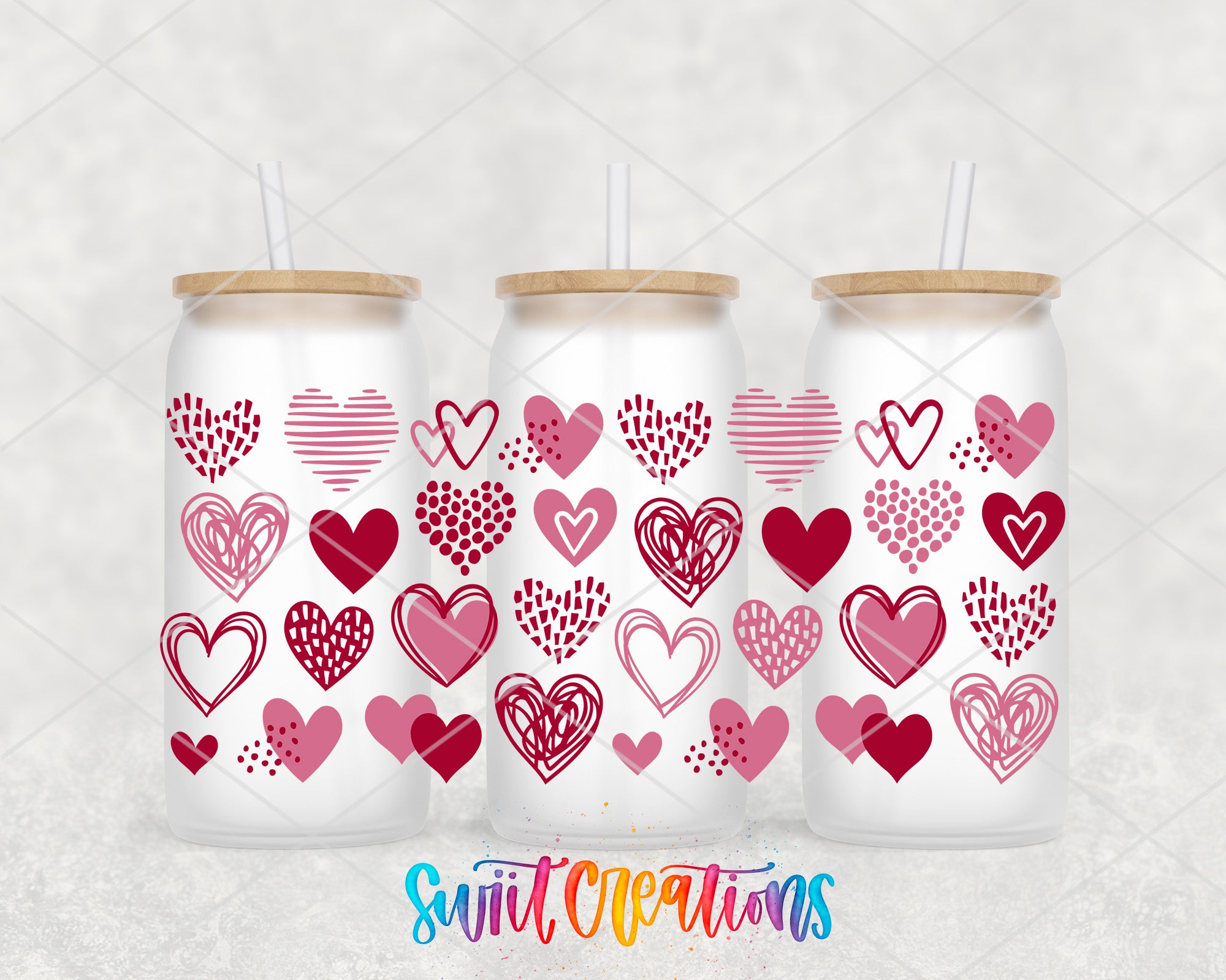 a set of three valentine's day tumblers with hearts on them