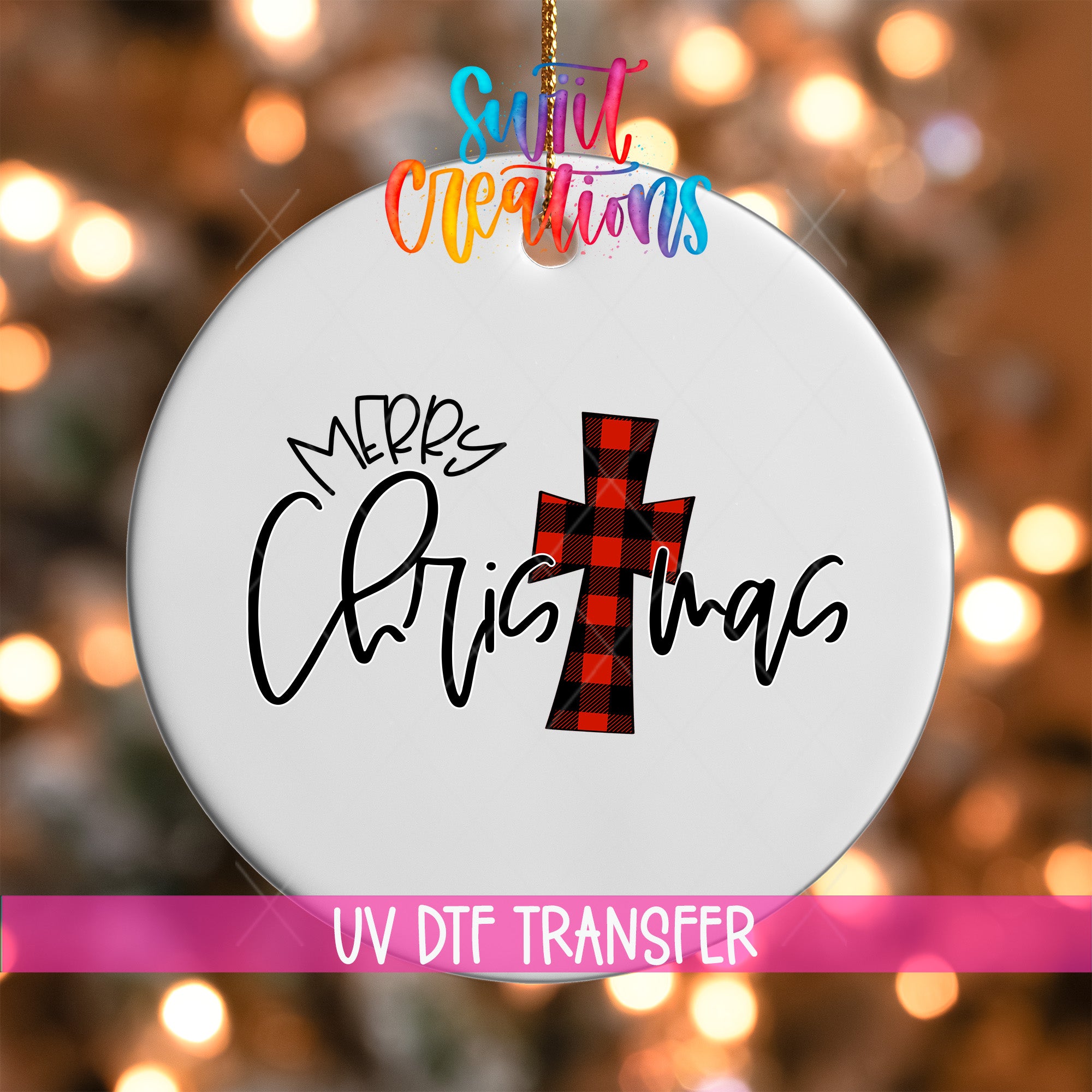 A white Christmas ornament with a red and black plaid cross design and the text "Merry Christmas" written on it.