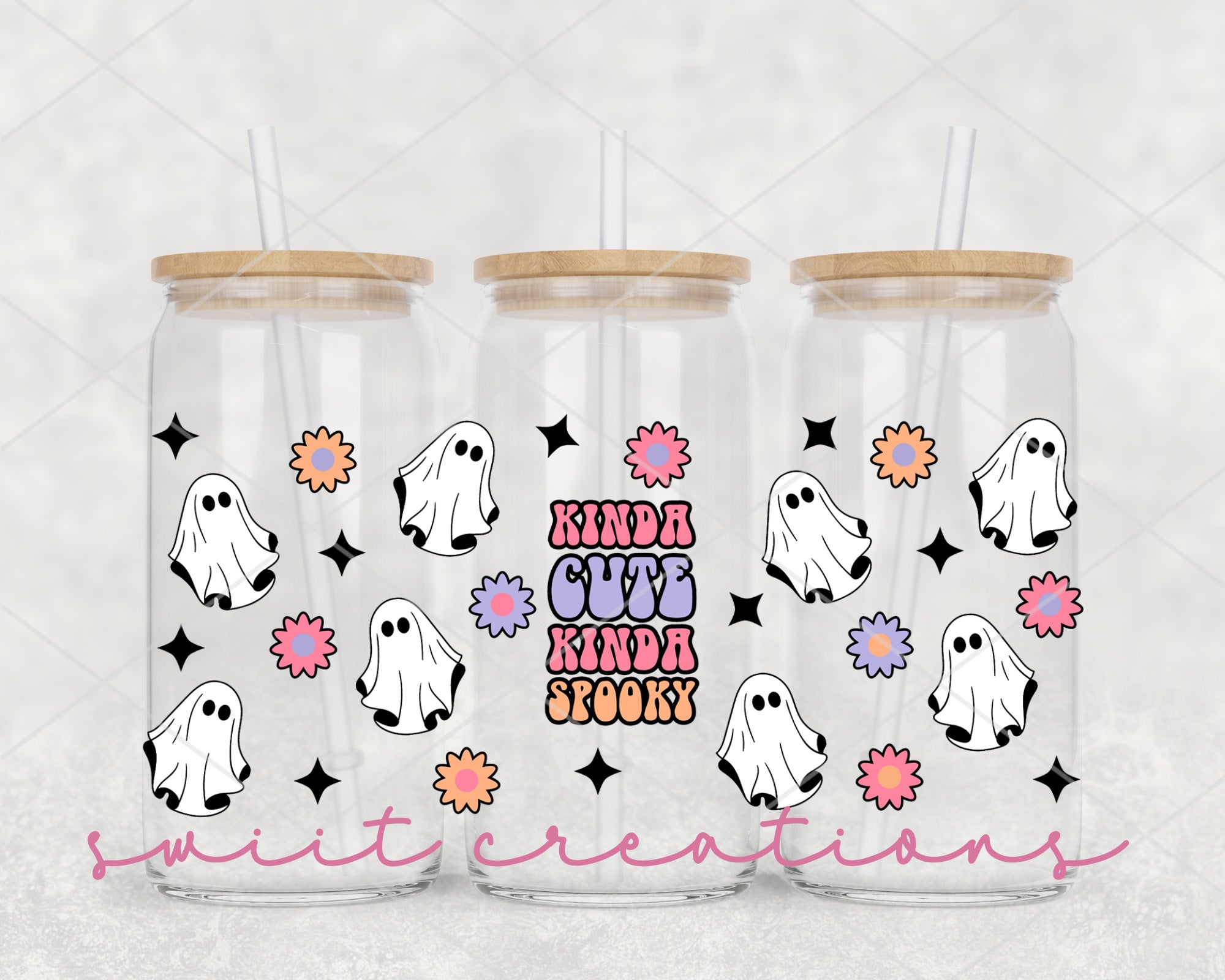 a pair of halloween tumblers with ghost faces on them