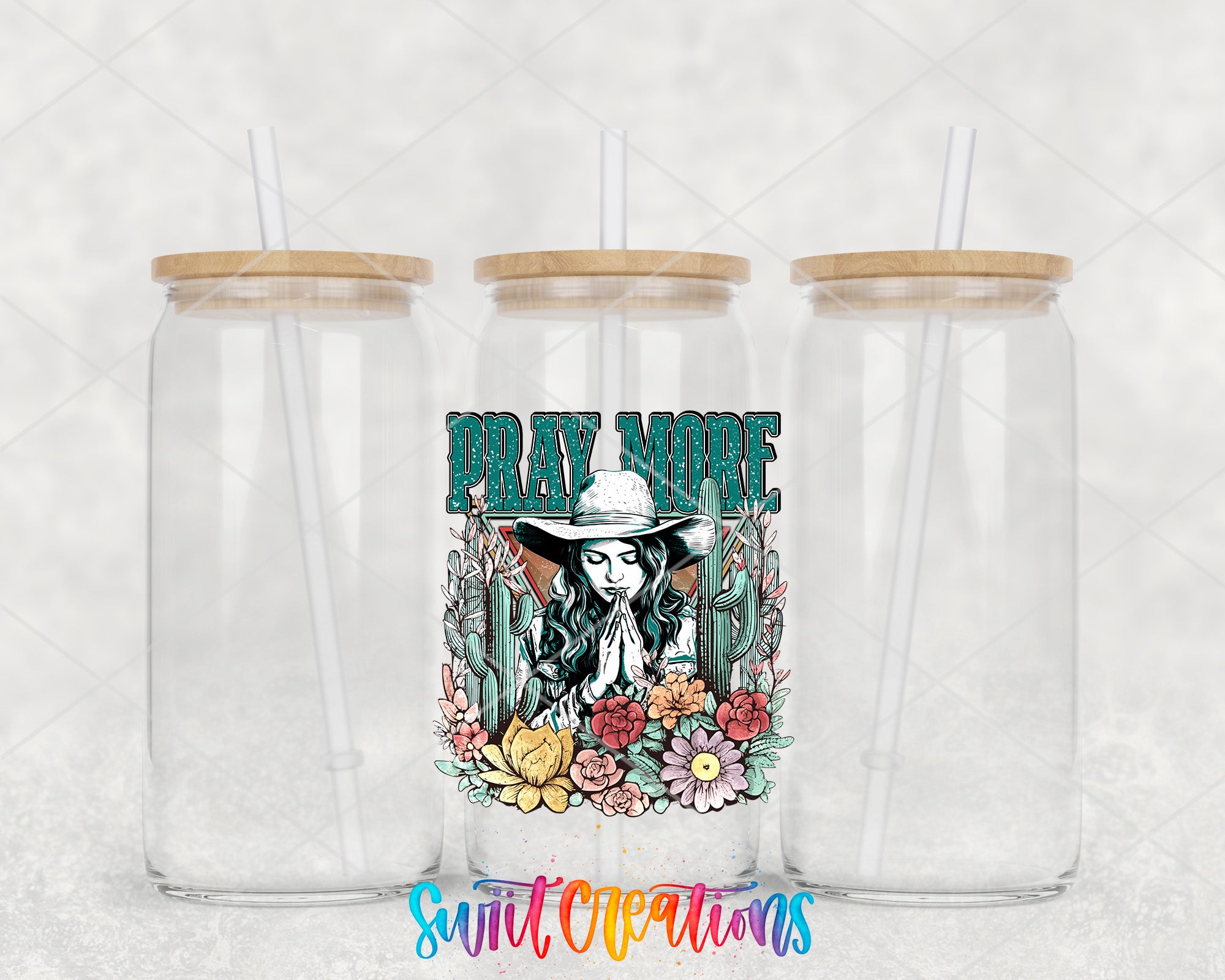 two clear tumblers with a cowboy design on them