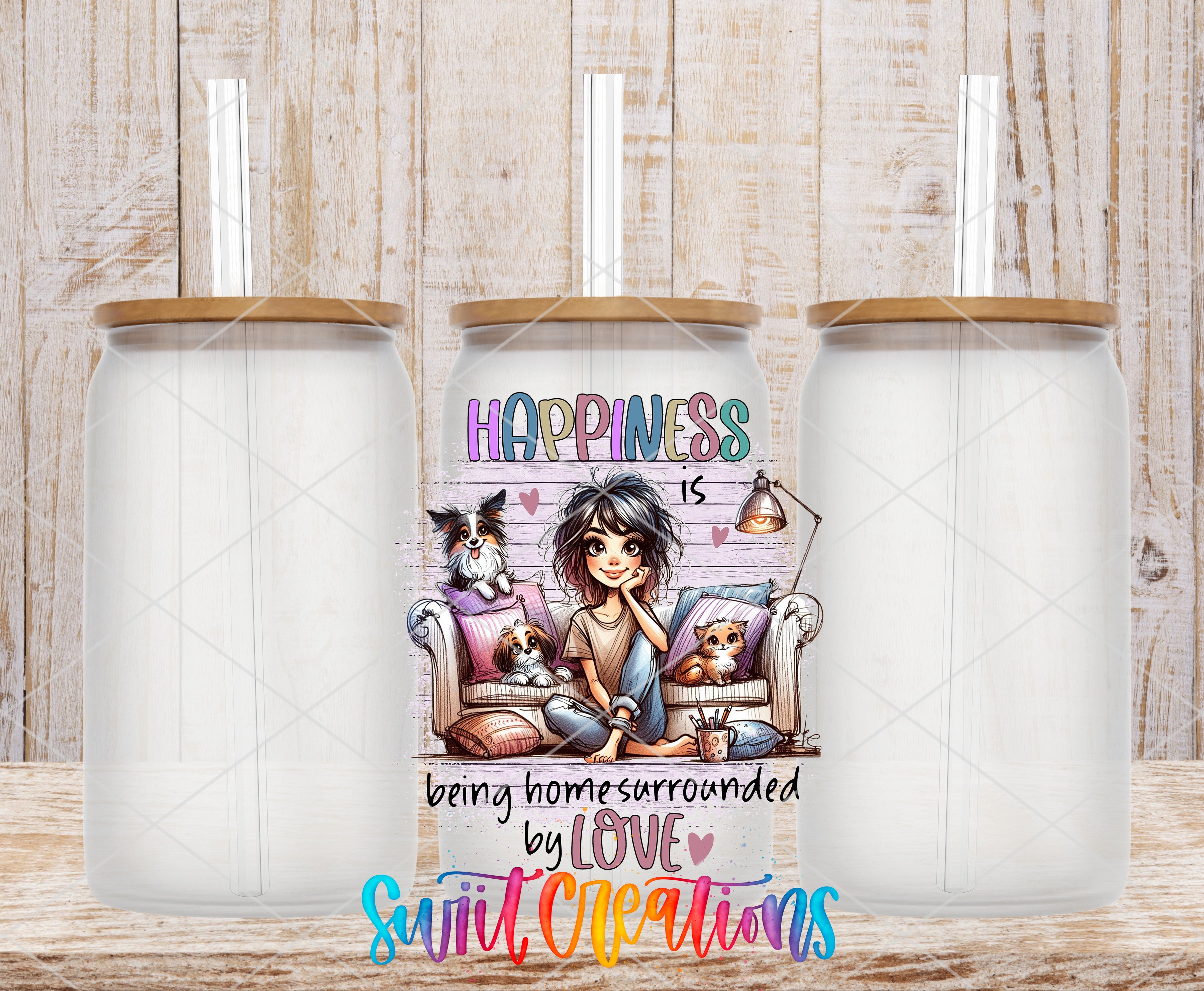 three glass tumblers with straws, each containing a straw. The tumblers have a colorful design depicting a cartoon girl sitting on a couch with a dog and a cat. The text on the tumblers reads "Happiness is being home surrounded by love", and the image is a collage of three smaller images.