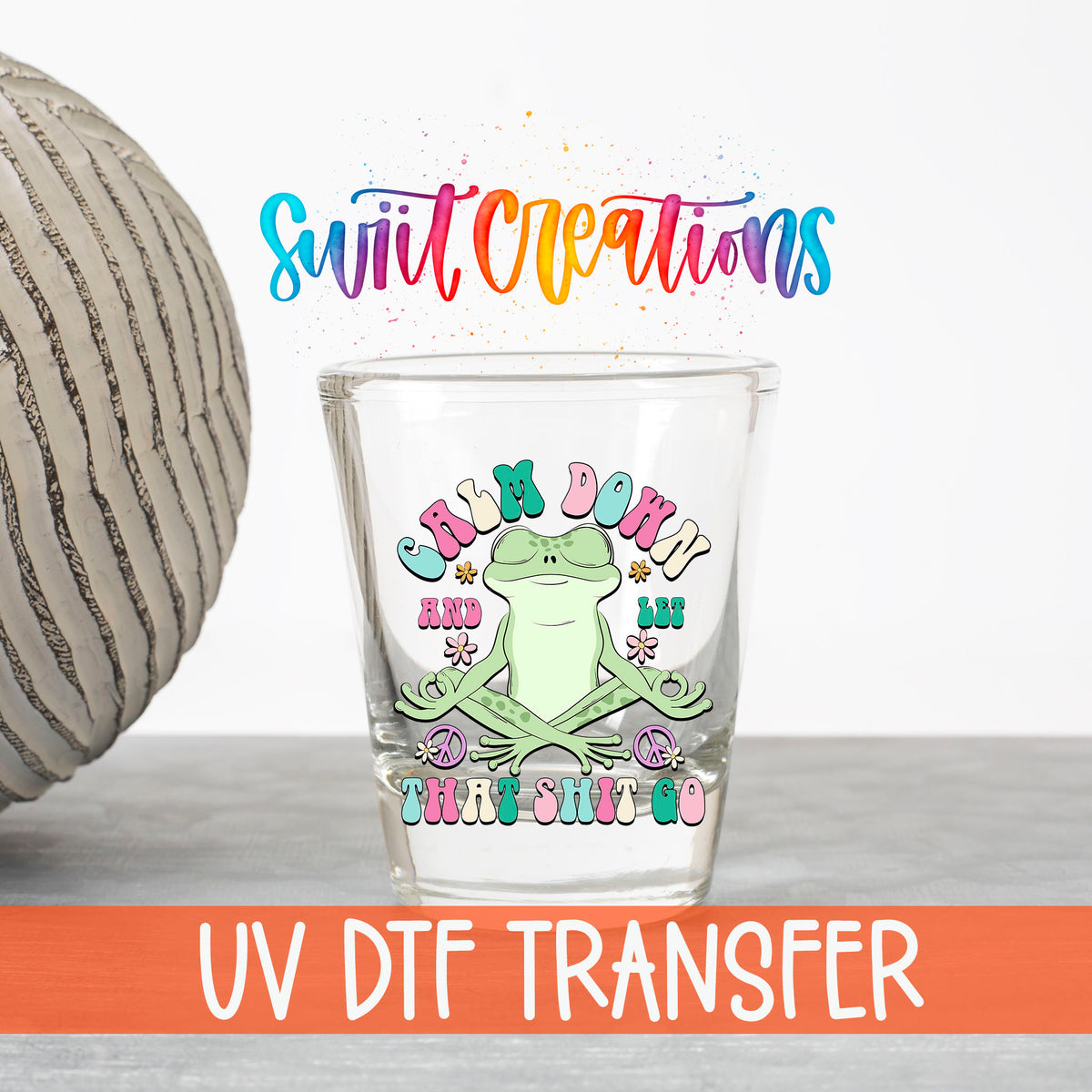 Calm Down And Let That Sh*t Go UV DTF transfer on a clear shot glass with the Swiit Creations logo and UV DTF Transfer banner