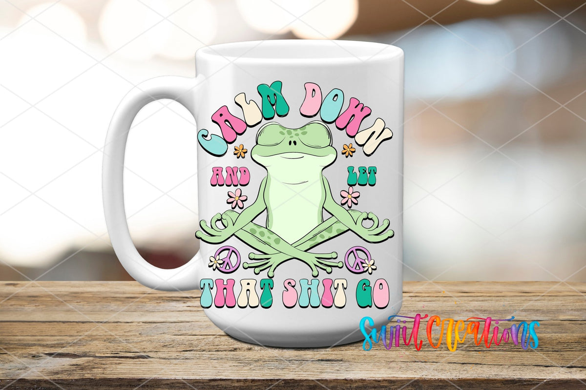 Calm Down and Let That Sh*t Go UV DTF transfer on a white ceramic coffee mug