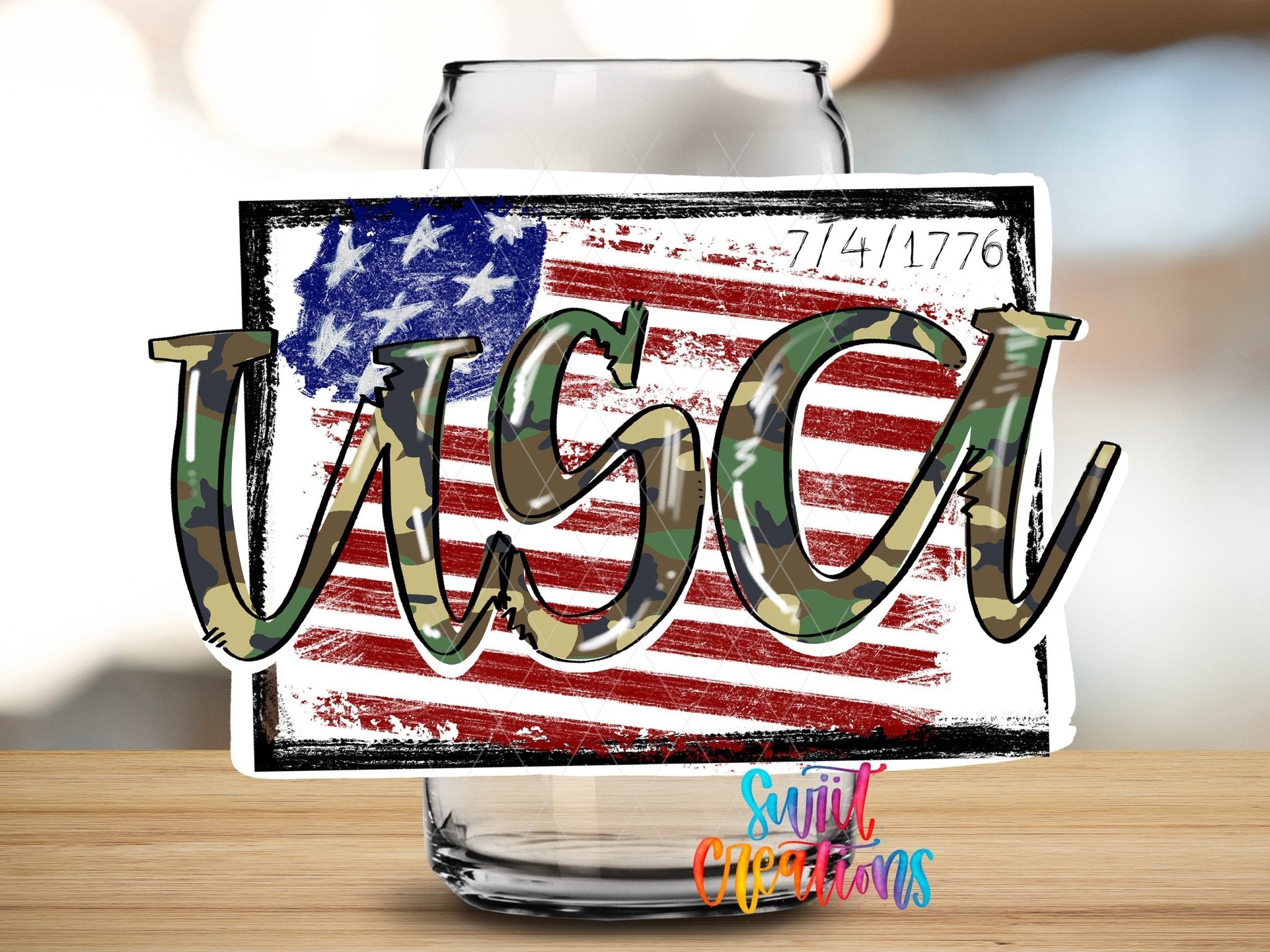 Swiit Creations Camo USA 1776 Flag camouflage lettering and distressed flag UV DTF transfer shown on a clear glass can
