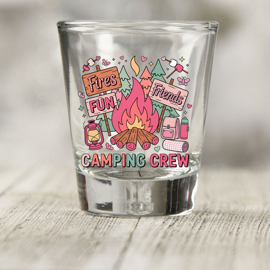Camping Crew shot glass UV DTF transfer with campfire, signs, trees, and camping gear details on a clear shot glass