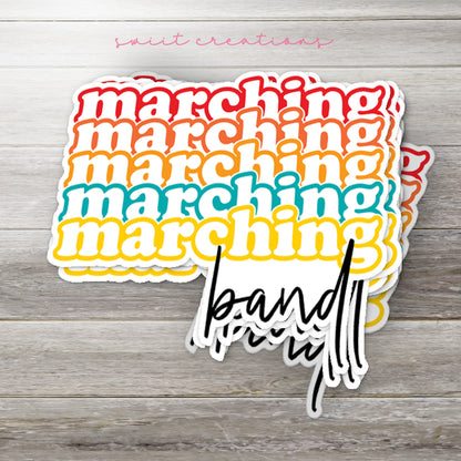 Stack of Retro Marching Band glossy stickers on a gray wood table