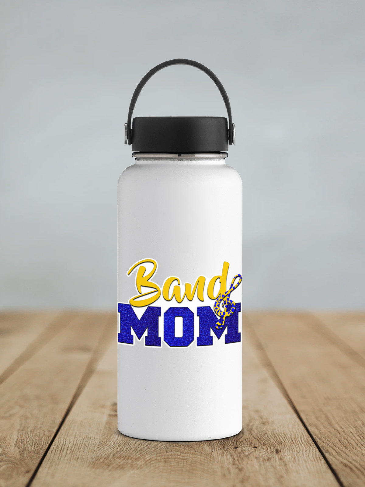Gold and Blue Band Mom sticker on a white insulated water bottle