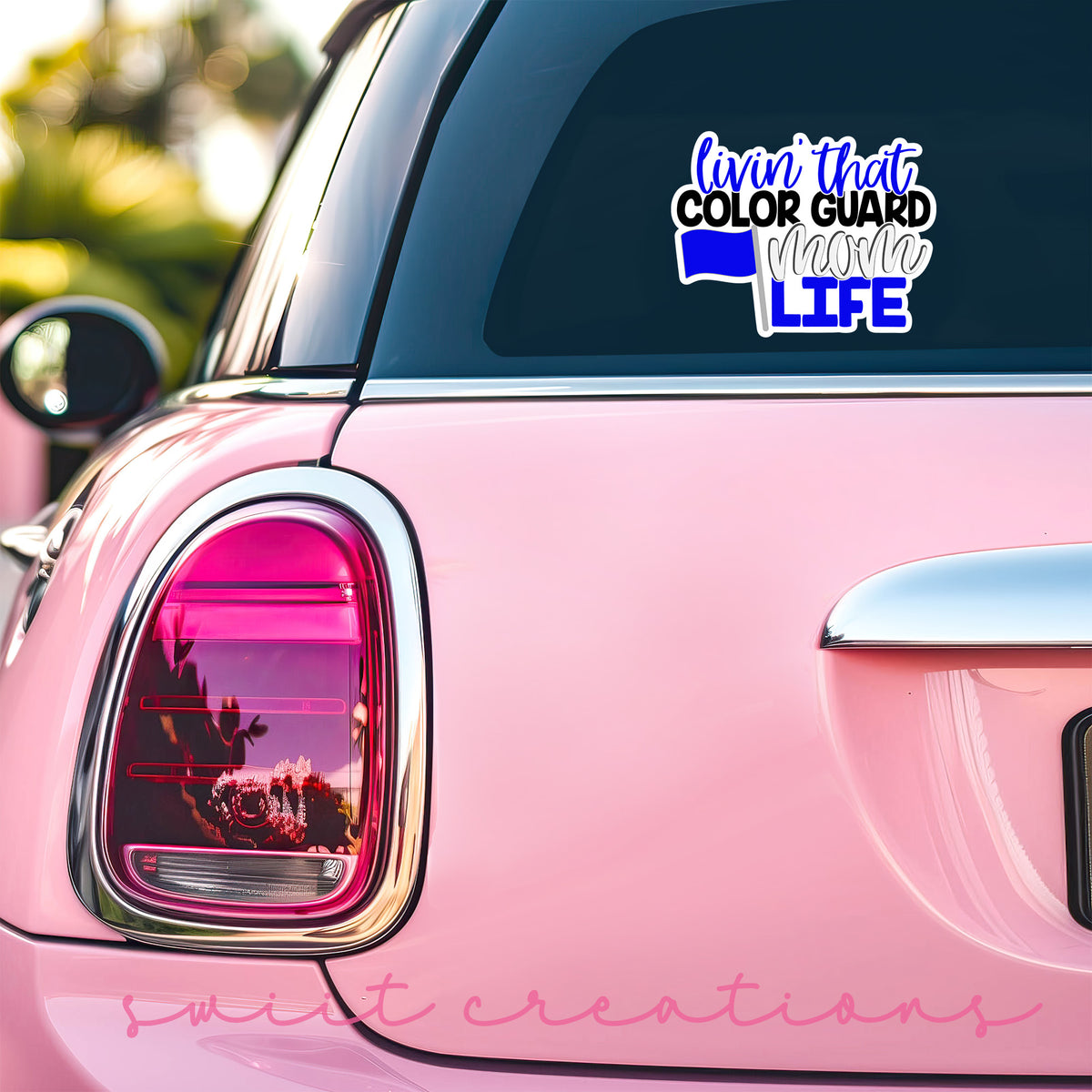 Livin' That Color Guard Mom Life sticker on the back window of a pink car