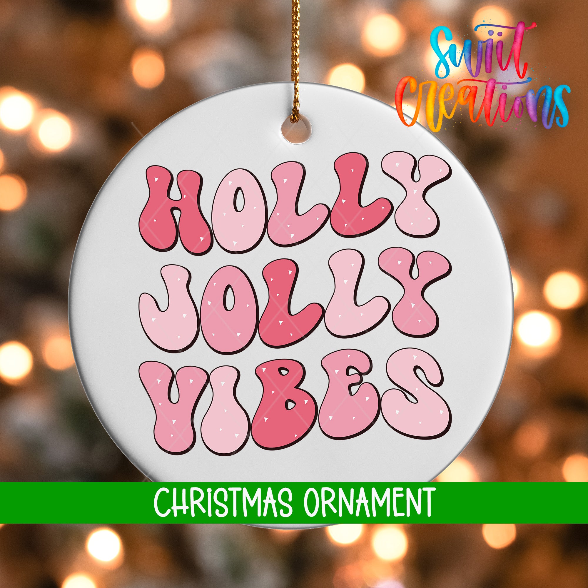 A white Christmas ornament with the text "HOLY JOYL VIBES" in pink and red letters.