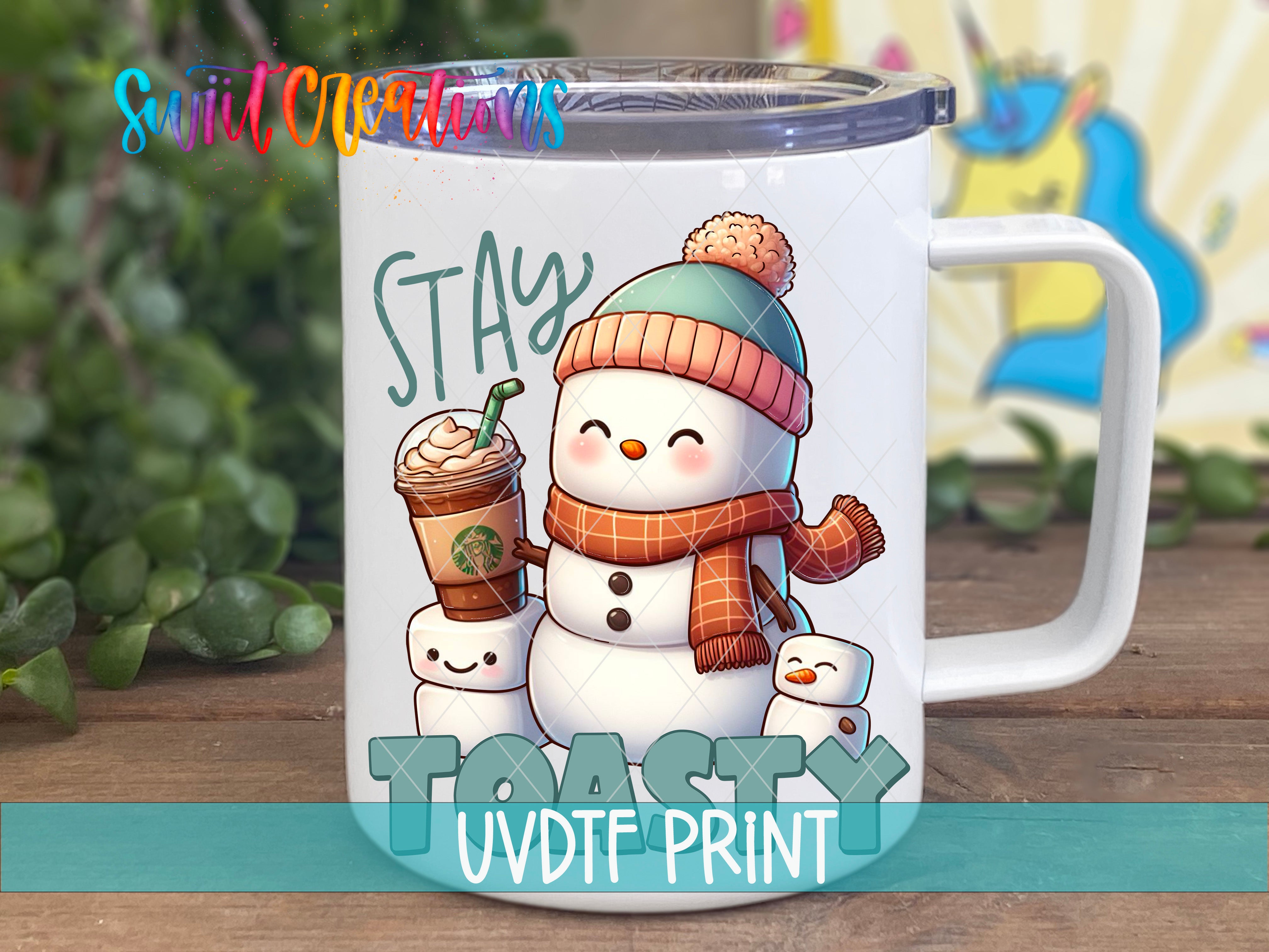 a white coffee mug with a snowman holding a cup of coffee