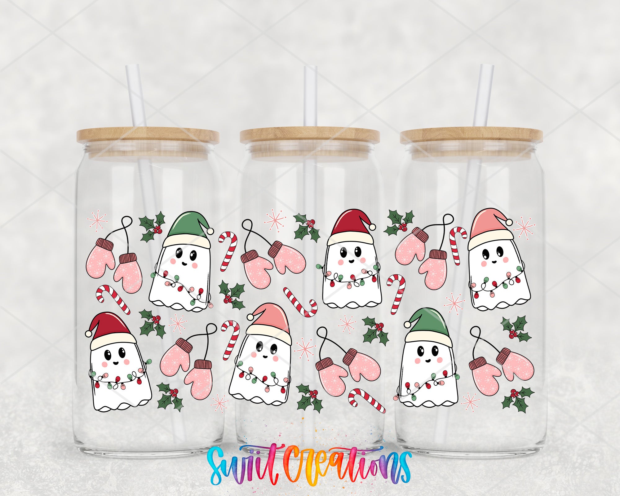 a couple of glass jars with christmas decorations on them