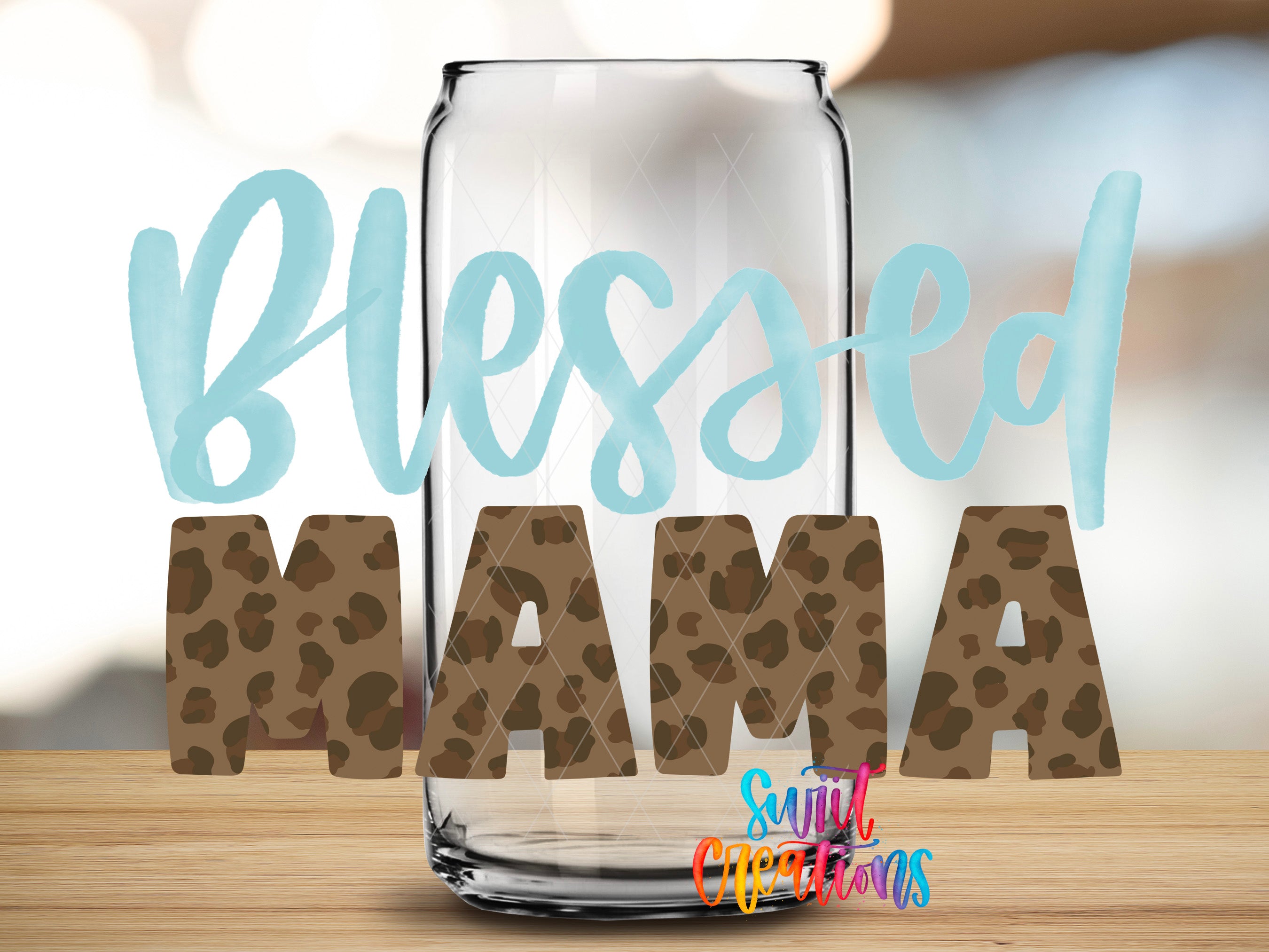 A glass jar with the text "Blessed MAMA" written on it, along with a blurred background.
