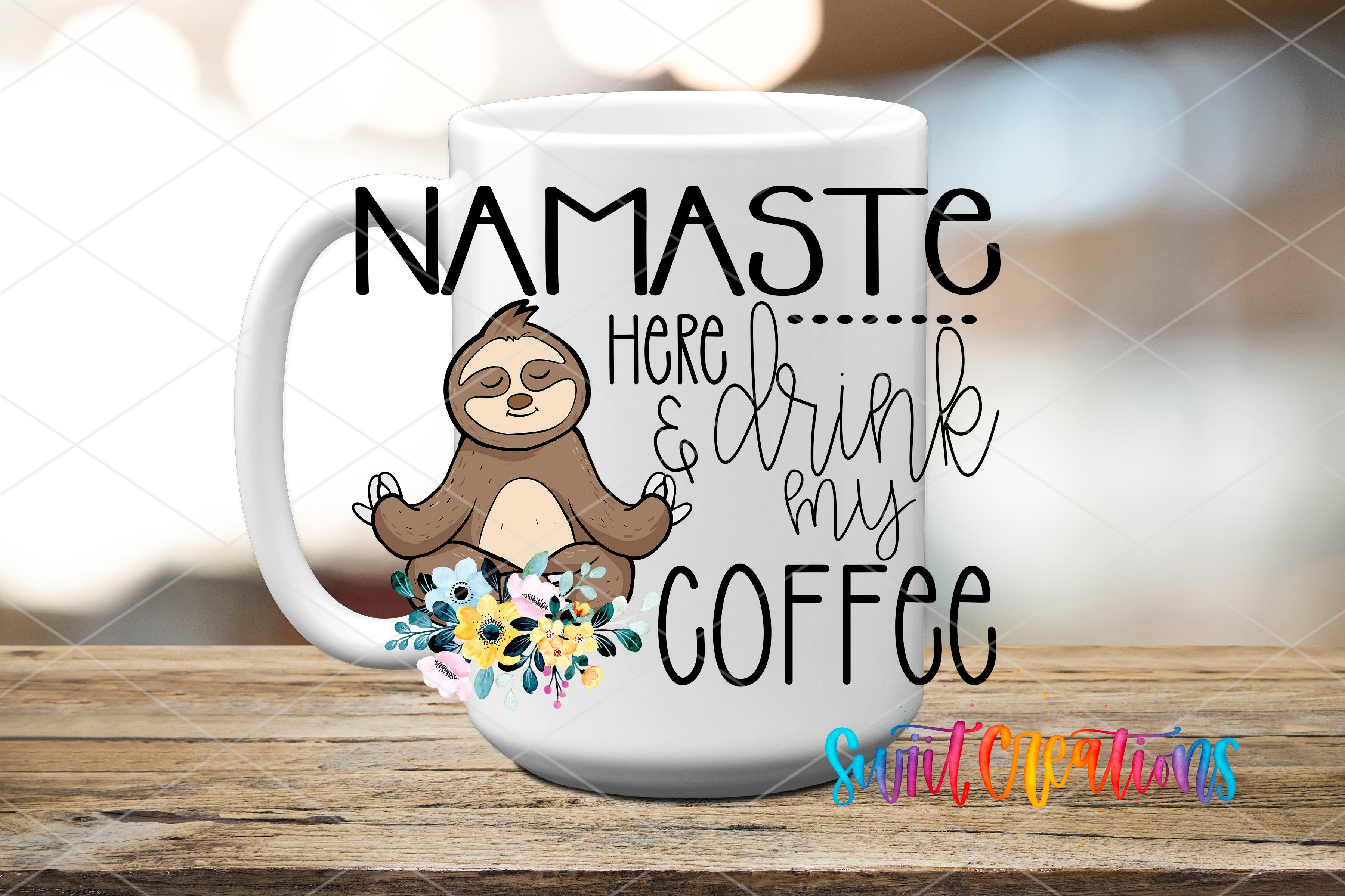 A white coffee mug with a sloth illustration and text that says "NAMASTE here... drink my COFFEE"