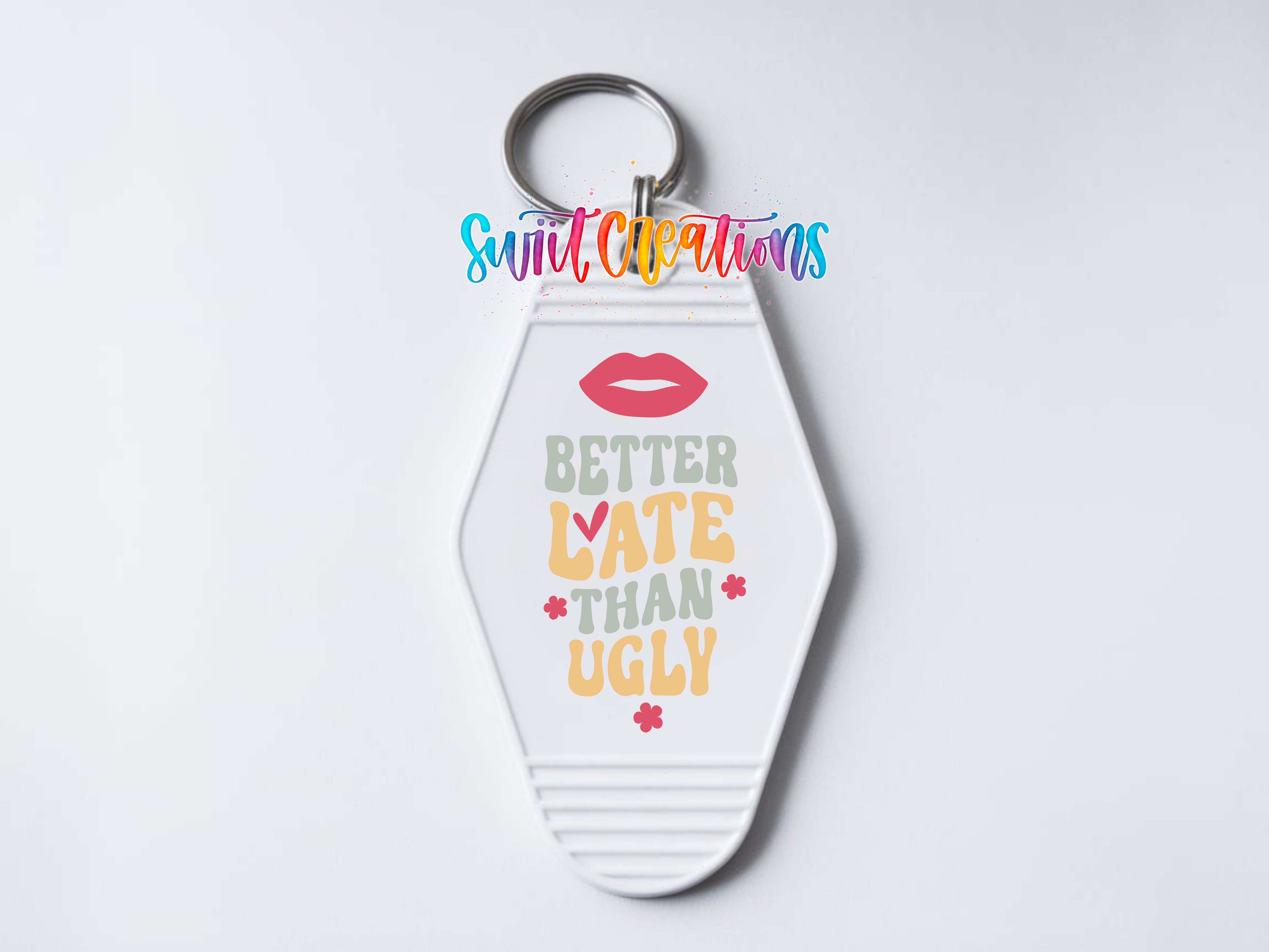 A keychain with a keyring and a colorful graphic design featuring text and flowers.