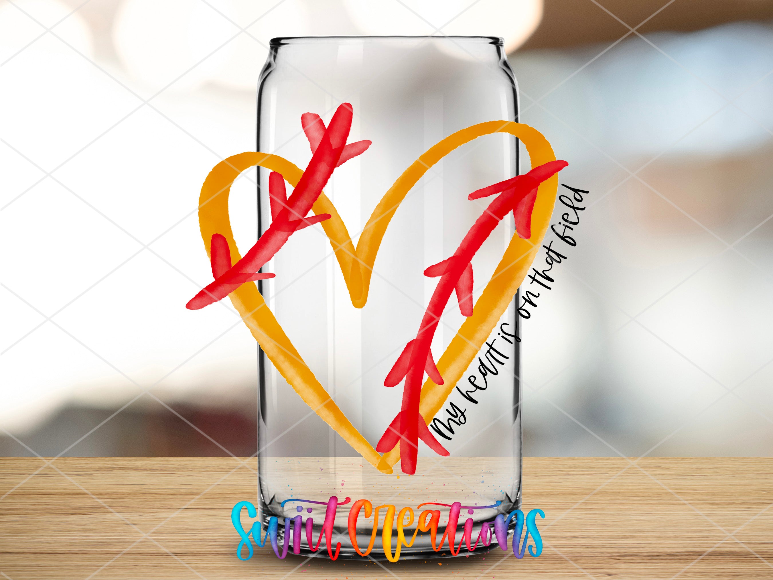 a glass vase with a heart and arrow cut out of it