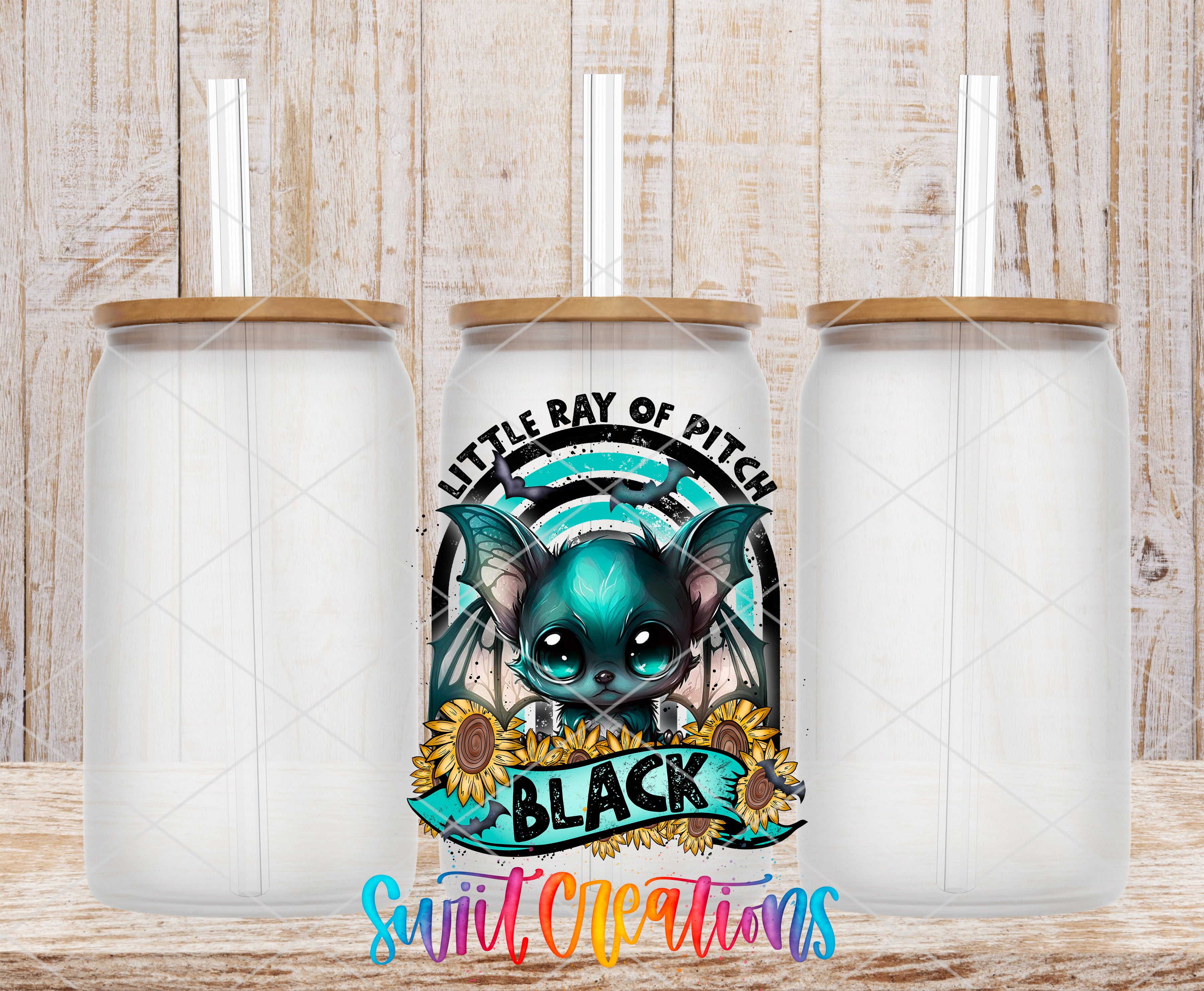 a colorful and whimsical design of a bat-like creature with a black body and blue wings, surrounded by sunflowers and the text "Little Ray of Pitch" and "Black".