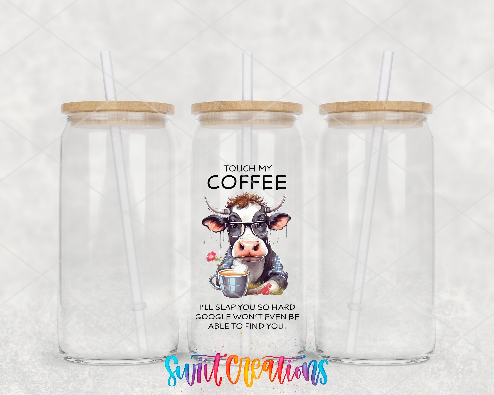 a couple of cups with a cow on them