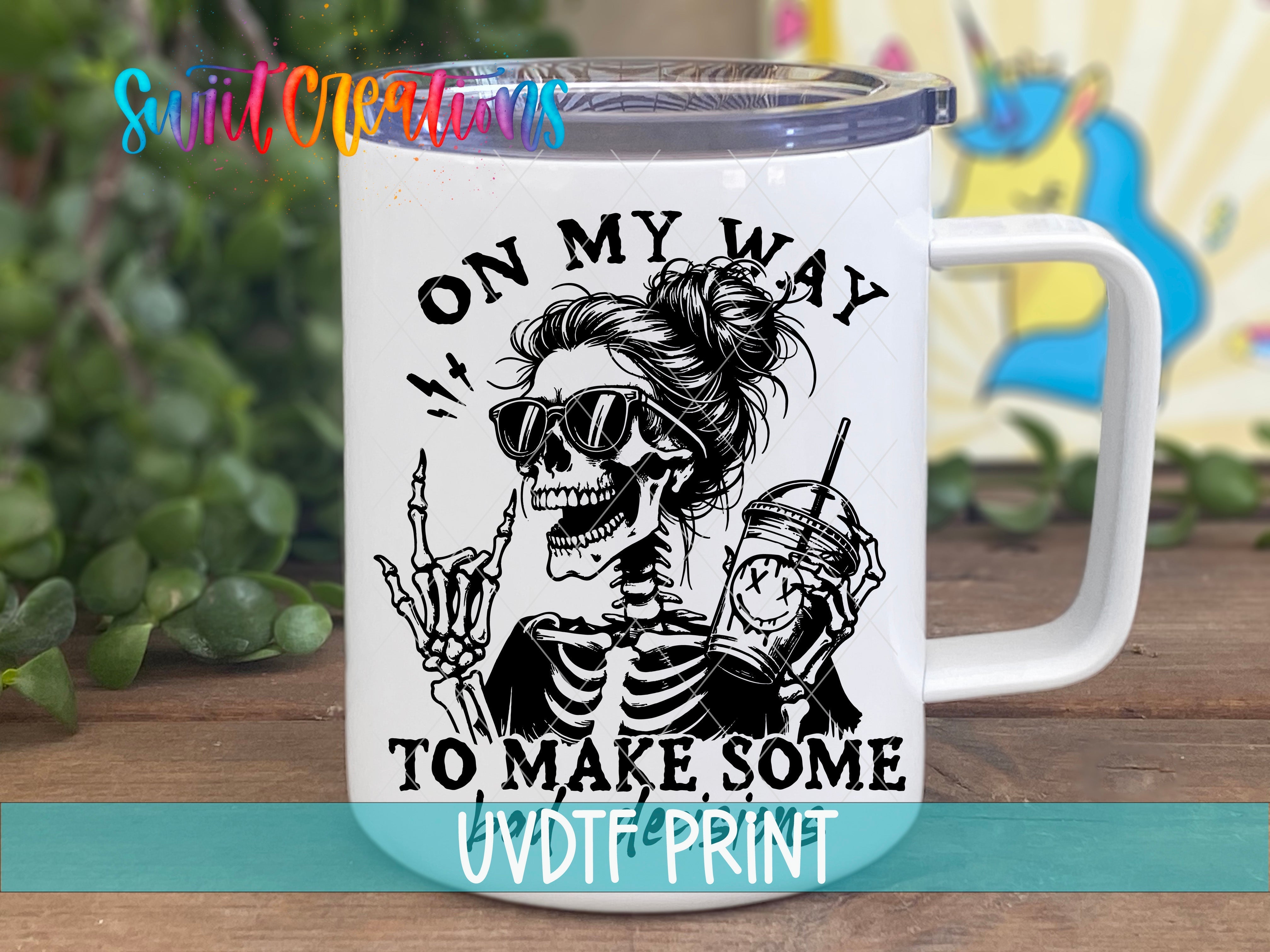 a white coffee mug with a skeleton on it