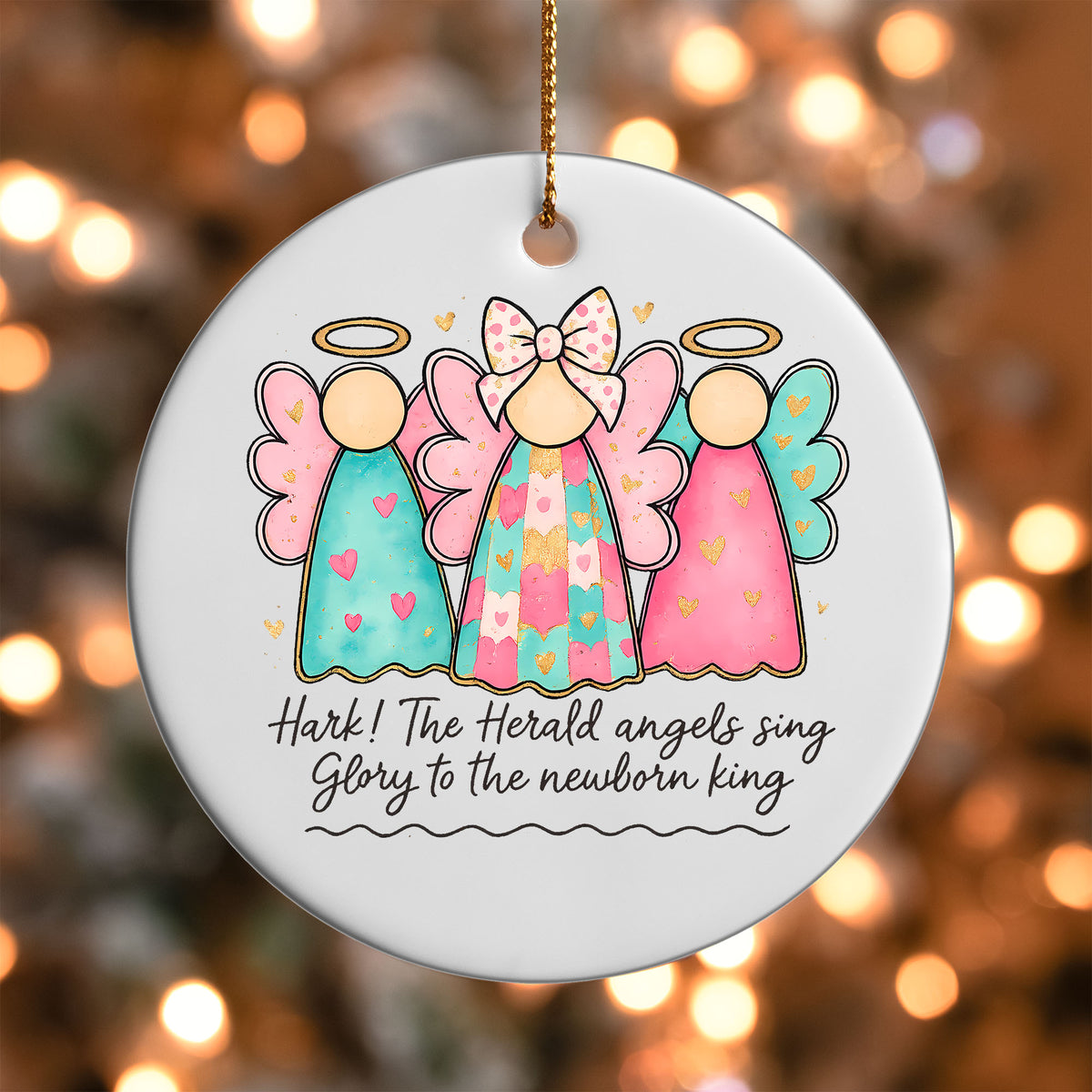 Christmas Angels ornament UV DTF transfer on a round white ornament with a bokeh light background