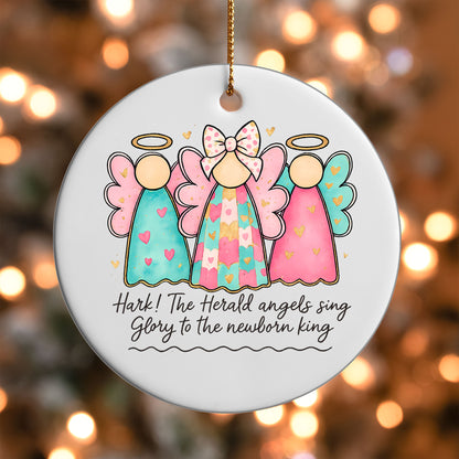 Christmas Angels ornament UV DTF transfer on a round white ornament with a bokeh light background
