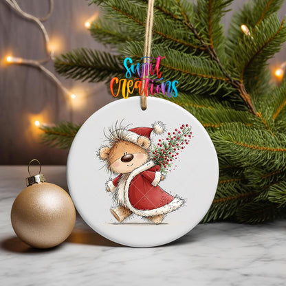 Christmas Berry Sack Teddy Bear ornament UV DTF transfer on a hanging ornament with pine branches and a gold bauble