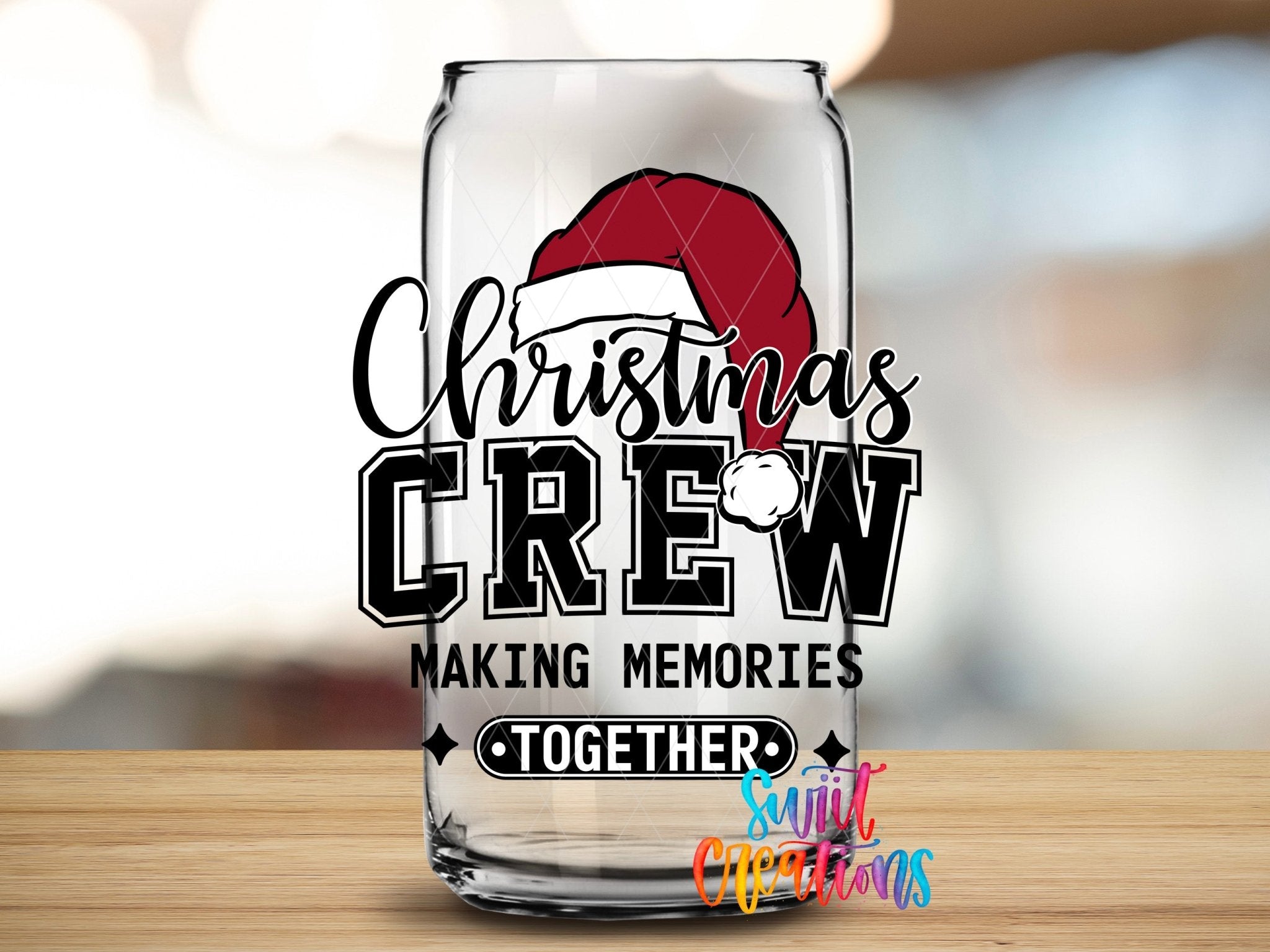 Swiit Creations UV DTF Christmas Crew Making Memories Together transfer applied to a clear glass can