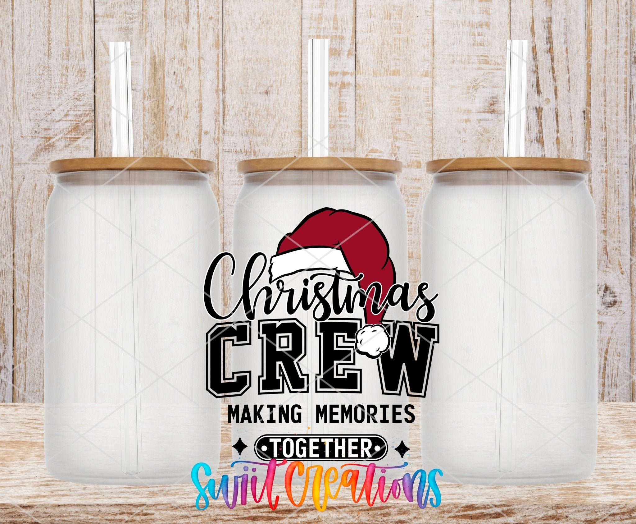 Swiit Creations UV DTF Christmas Crew Making Memories Together transfer shown on a clear glass can set