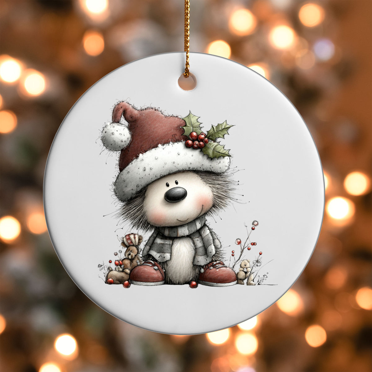 Christmas Hedgehog ornament UV DTF transfer on a round white ornament with a bokeh light background