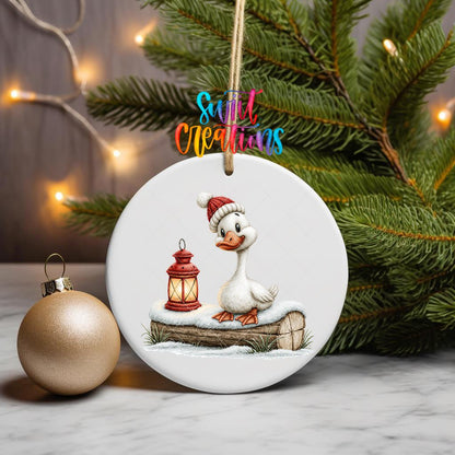 Christmas Lantern Goose ornament UV DTF transfer on a hanging ornament with pine branches and a gold bauble