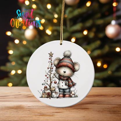 Christmas Mouse ornament UV DTF transfer on an ornament on a wooden table with tree lights behind it