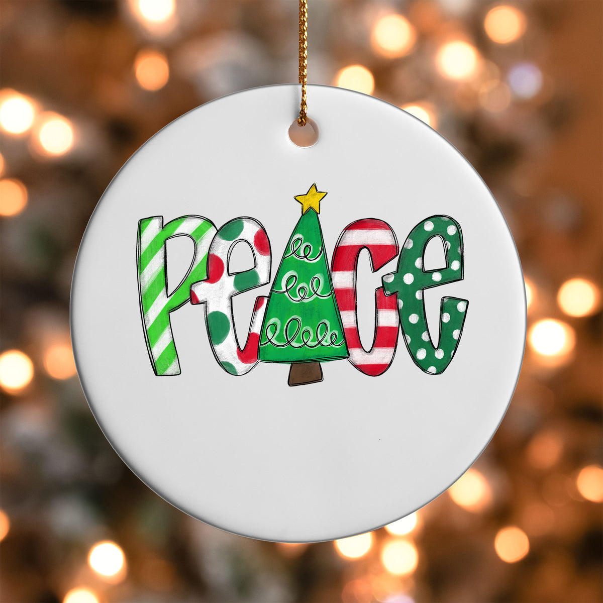 Christmas Peace ornament UV DTF transfer on a round white ornament with a bokeh light background