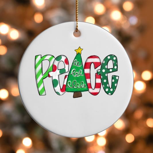 Christmas Peace ornament UV DTF transfer on a round white ornament with a bokeh light background