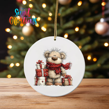 Teddy Bear with Gifts ornament UV DTF transfer on an ornament on a wooden table with tree lights behind it