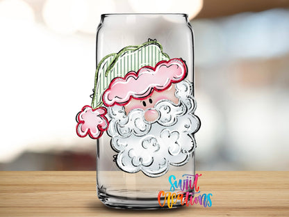 Close-up of the Pink Santa Face UV DTF transfer on a clear glass can
