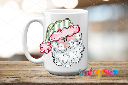 Pink Santa Face UV DTF transfer on a white ceramic coffee mug