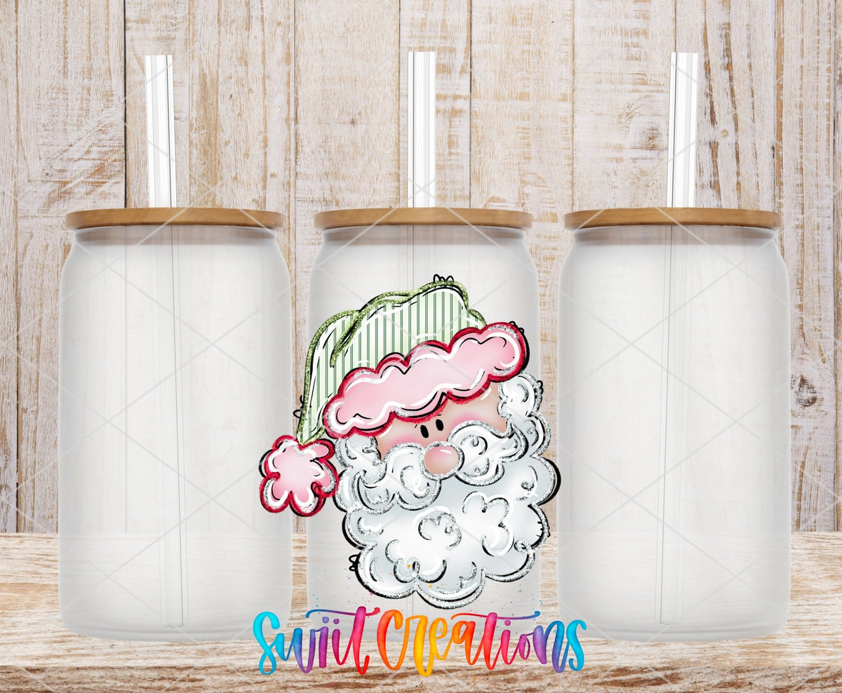 Pink Santa Face UV DTF transfer on frosted glass cans with bamboo lids