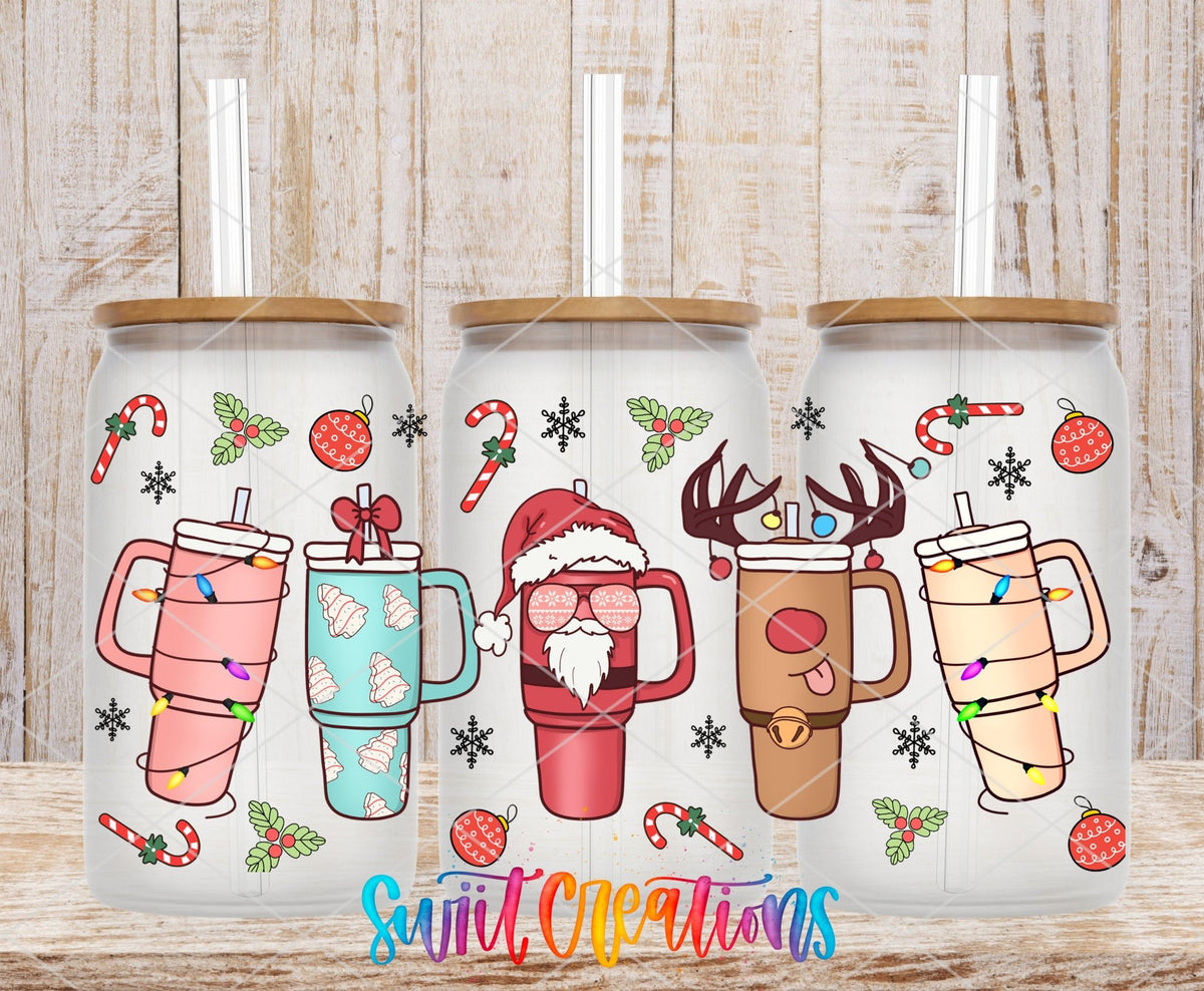 Christmas Tumblers UV DTF full wrap on three clear glass cans with bamboo lids