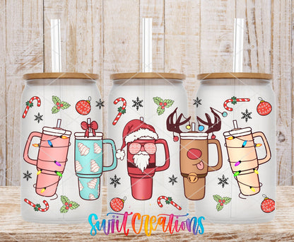 Christmas Tumblers UV DTF full wrap on three clear glass cans with bamboo lids