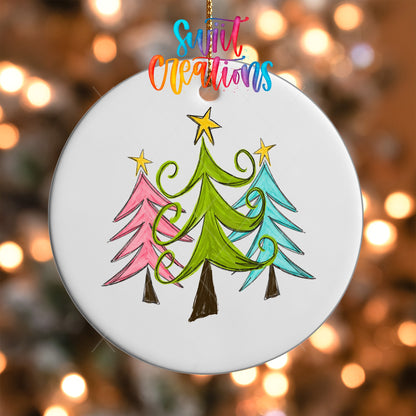 Close-up of the Whimsical Christmas Trees UV DTF transfer on a round white ornament
