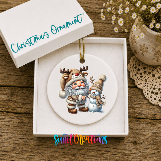 Whimsical Santa reindeer and snowman ceramic Christmas ornament displayed in the included gift box