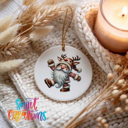 dancing Santa in a reindeer costume ceramic Christmas ornament styled beside a candle and cozy knit blanket