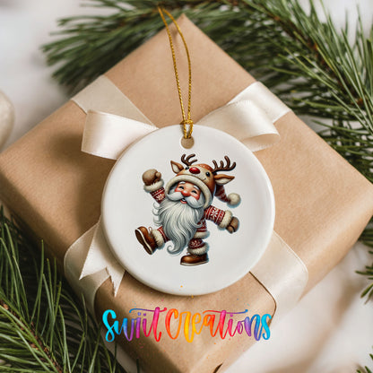 dancing Santa in a reindeer costume ceramic Christmas ornament arranged on a wrapped Christmas gift